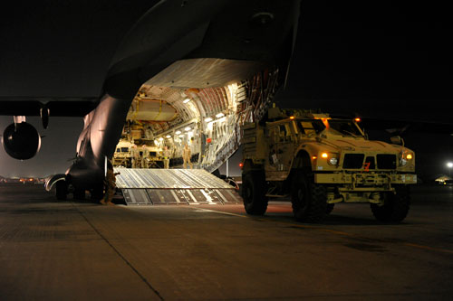 USAF crews load  Joint Light Tactical Vehicles (JLTV) onto a C-17 from retrograde of people and equipment throughout Afghanistan in December 2014. USAF Image.
