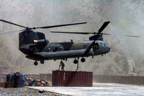 SSG George Beckett, C Troop, 3-71 Cavalry Squadron, 10th Mountain hooks a conex to a CH-47 to deliver to a combat outpost (COP) in northeastern Afghanistan.  U.S. Army Image