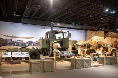 Diorama containing at cargo HMMWV and M915A1 truck at a Transportation convoy rest area in Iraq on display at the U.S. Army Transportation Museum.