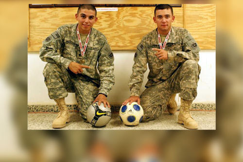 Sept. 13, 2009 SPC Madueno and SPC Zander, both from 2nd platoon, 62nd Transportation Company, 751st Combat Sustainment Support Battalion, 10th Sustainment Brigade pose with their gold medals after winning the international Soccer tournament at Al Asad Airfield in Iraq in September 2009.  US Army Image.