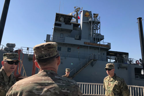 CW3 Senn, vessel master of the Logistics Support Vessel MG Charles P. Gross (LSV 5), briefs MG  Walker, Commanding General of the 1st Theater Sustainment Command, at the Kuwait Naval Base, Kuwait, Feb. 6, 2019. US Army Image.