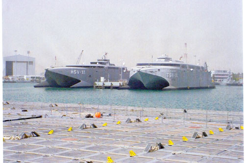 The HSV JOINT VENTURE (US Navy crew) and TSV SPEARHEAD (US Army crew) at Kuwait Naval Base for Operation Iraqi Freedom in 2003.  Part of the research collection of the U.S. Army Transportation Museum.