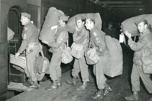 329th Harbor Craft Co Soldiers, entrain at Pier 8 Hampton Roads Port of Embarkation heading for Camp Patrick Henry upon their return to the United States in 1945