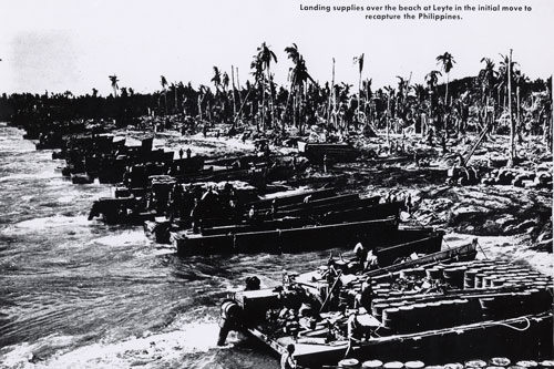 Landing craft crowd the beach at Leyte during the initial stages to recapture the Philippines during World War II.  