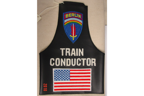 Train Conductor Brassard worn by Soldier on the Berlin Duty Train during the 1970s.  Part of the artifact collection of the U.S. Army Transportation Museum.