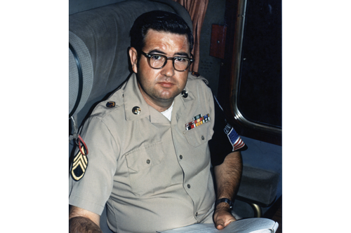 SSG Scott, Train Conductor on the Berlin Duty Train reviewing reports inside of Crew Car in August of 1972