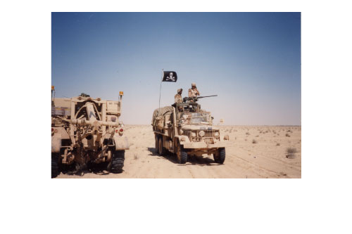 5-Ton truck from 628th Transportation Company with ring mount providing security for vehicle recovery mission during Desert Storm in Iraq, 1991. Part of the research collection of the U.S. Army Transportation Museum.