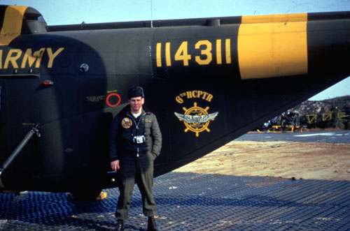 Transportation Corps Soldier stands in front of his H-19 Chicksaw on a Korean airfield in 1953.  Part of the research collection of the U.S. Army Transportation Museum.