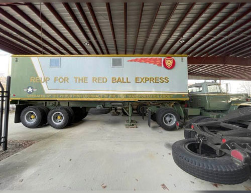 M129A1C Trailer painted with 'Red Ball Express' colors and logos used by 4th Transportation Brigade, 37th Transportation Group for recruiting efforts and public events  in Europe in the 1980s.