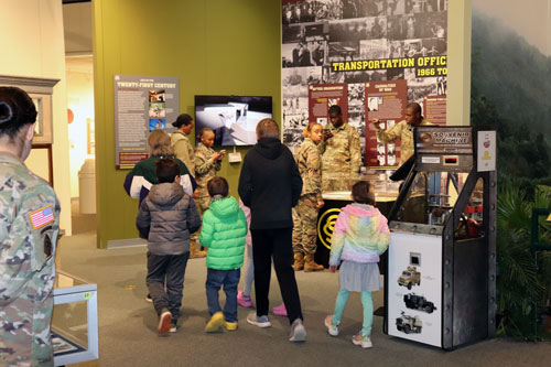 Individuals in the OCS Exhibit within the TC Museum.