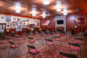 An image of the COL Clos Regimental Room from the back of the room looking to the front of the room.