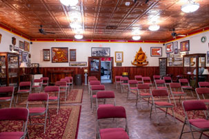 An image of the COL Clos Regimental Room from the front of the room  looking toward the back of the room.