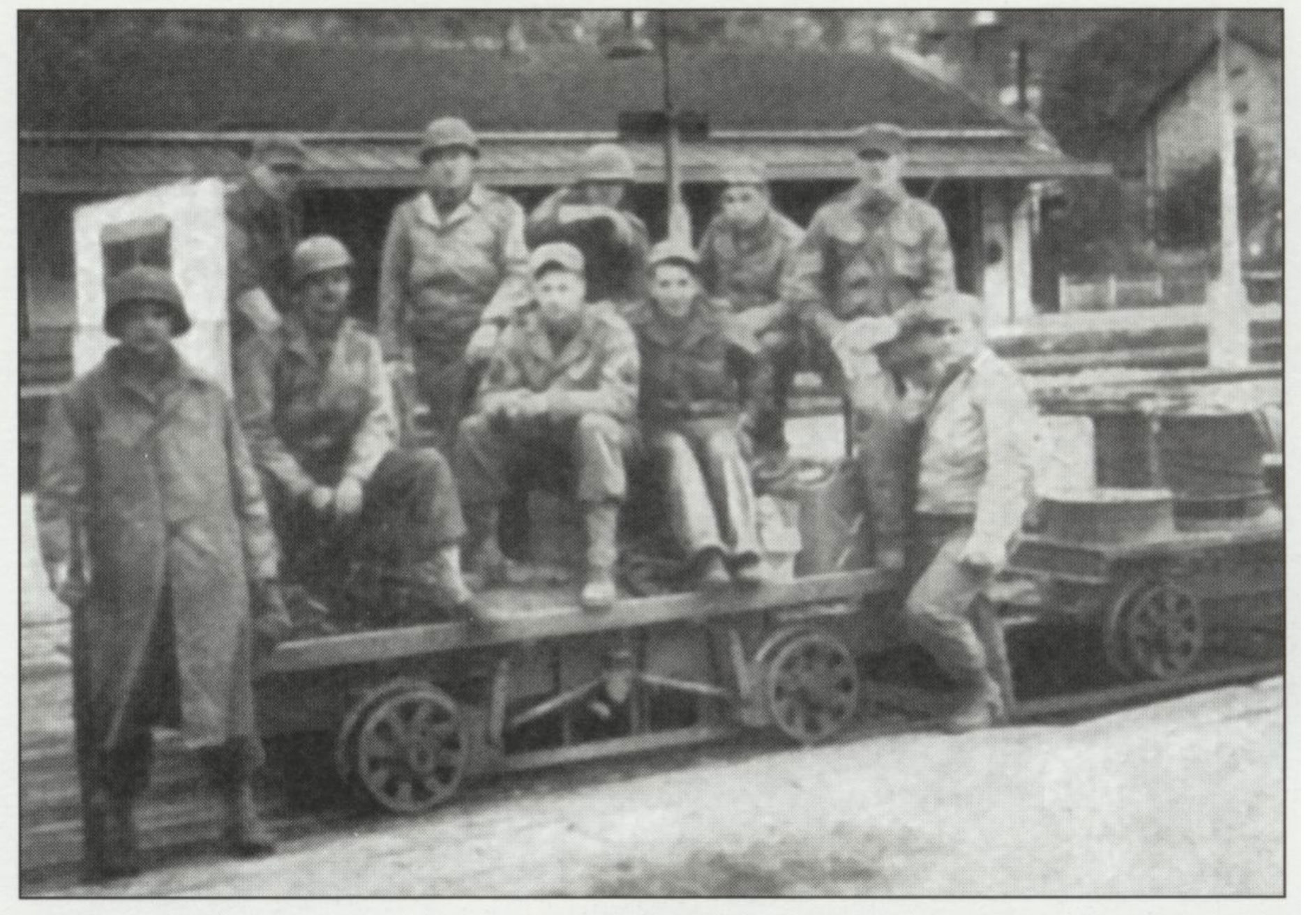 Some members the 718th signal platoon somewhere in France. Seated, from left to right, are Ervin Simpson, Sgt. George Adams, and Bill Moore. Note: All photos in this article, except where noted, come from History of the 718th ROB Transportation Corps.