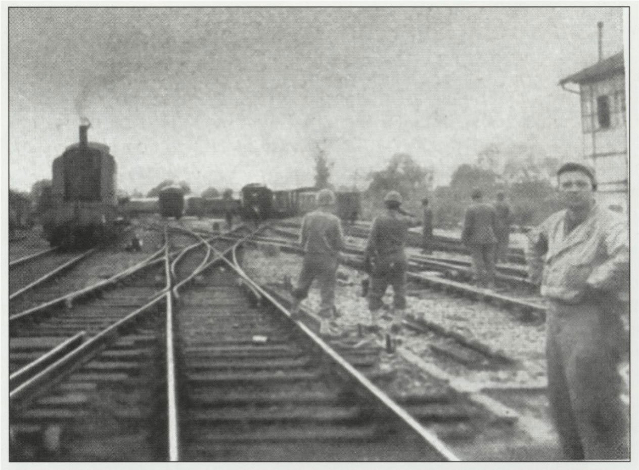 After landing at Utah Beach, the 718th was dispatched to the tiny junction town of Folligny, where it repaired damaged track and rolling stock and established
	train service to help supply troops moving eastward toward Paris.