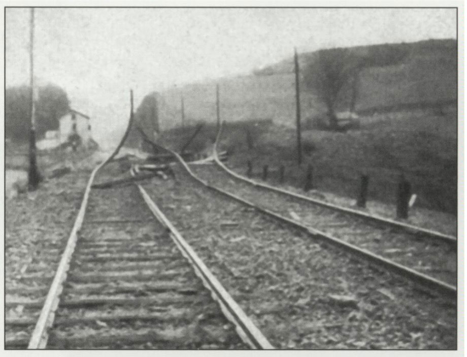 As the 718th 	approached the Belgian-German border, rails were twisted into pretzels and the right of way mined, posing a constant hazard to linemen and operating crews.