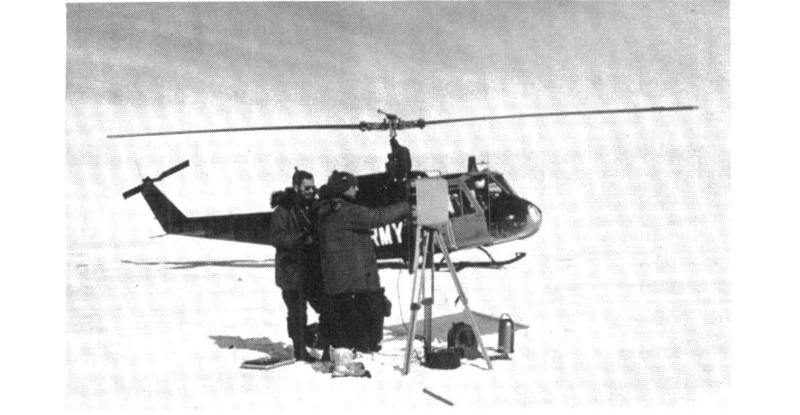 U.S. Geological Survey engineers making measurements after being ferried to field site by helicopter. U.S. Navy Photo