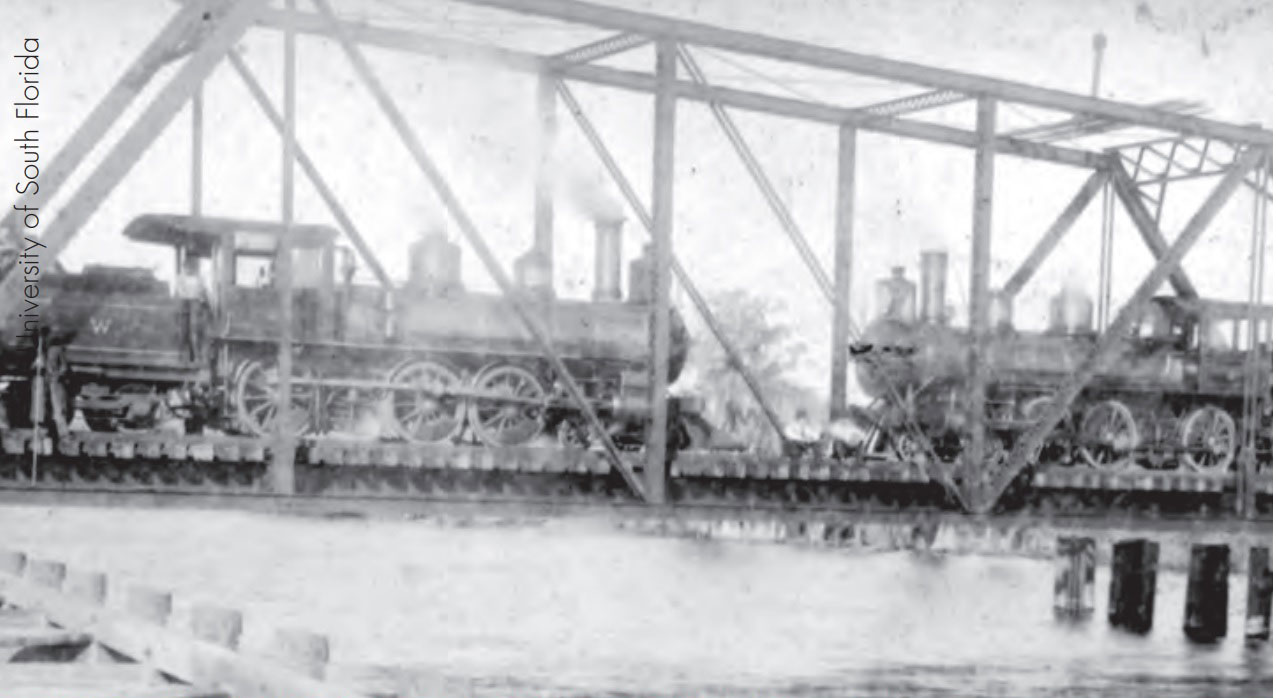  Two trains stopped on a trestle near the port of Tampa, c. 1898.