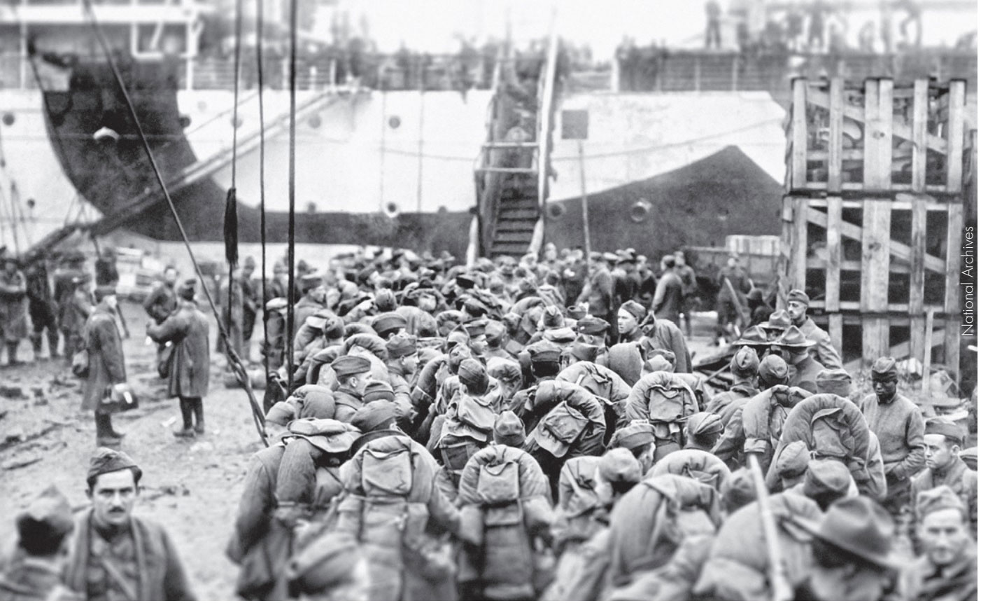 Troops waiting for their turn to board the ship home, c. 1919.