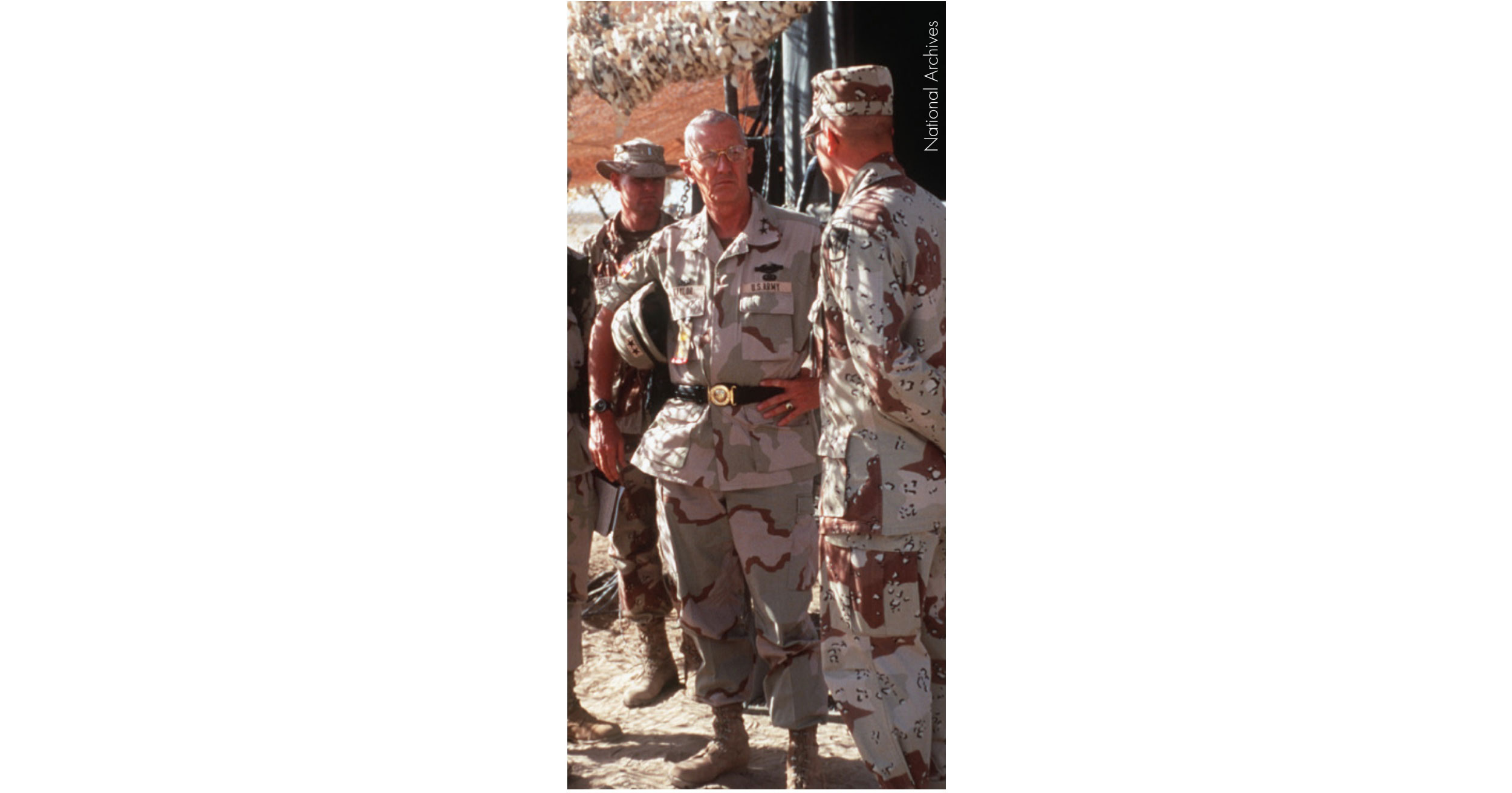General Taylor (Center) speaks with a soldier at Tactical Assembly Area Liberty outside Kuwait City.