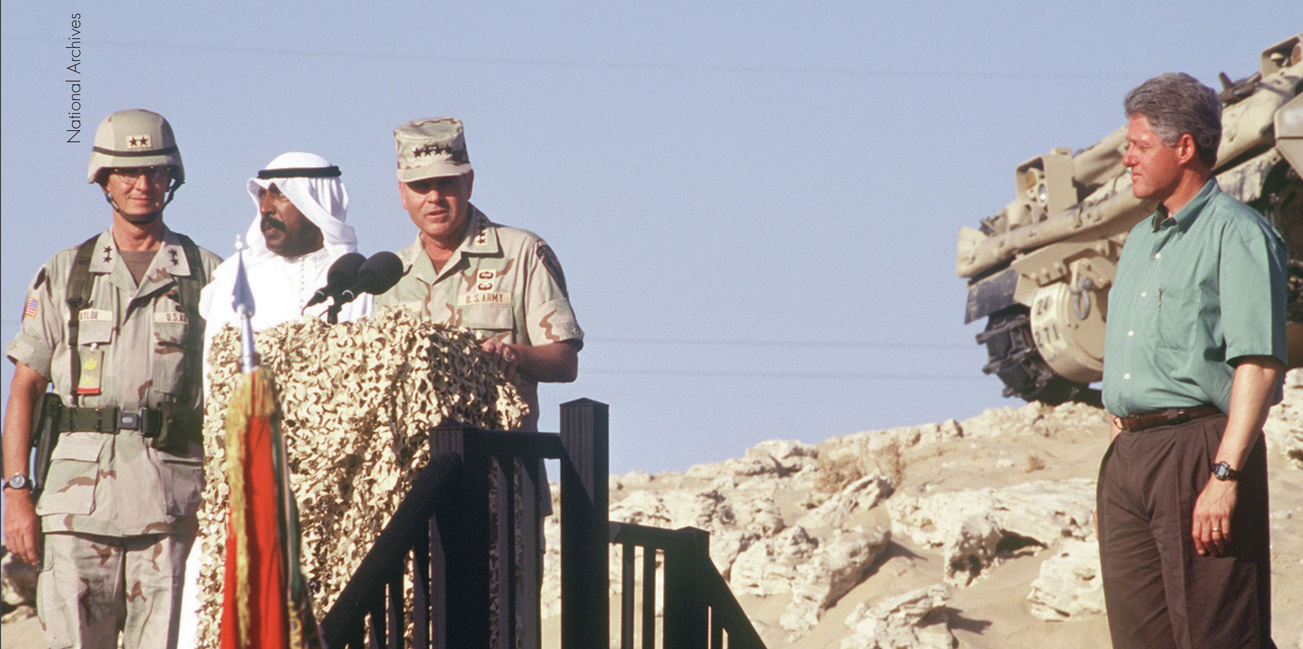 (From left to right) General Taylor; Saad Al-Salim Al-Sabah, the crown prince of Kuwait; General Peay; and President Clinton address troops during Operation Vigilant Warrior.
