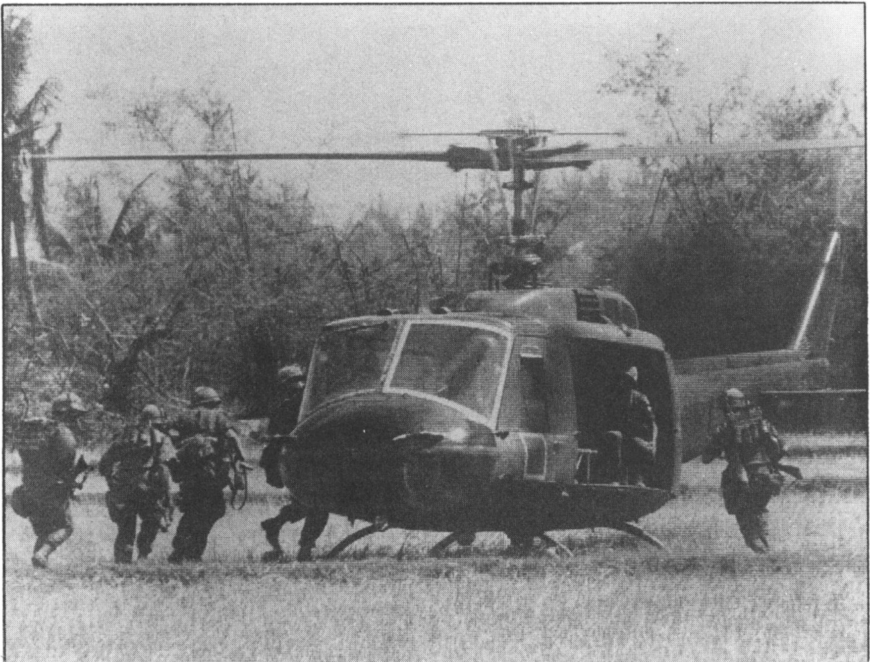 UH-1B Bell (Huey) picking up 1st Air Cavalry reconnaissance troops north of Bong Son Plains, South Vietnam, June 1967.