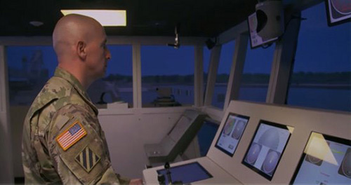 Transportation Warrant Officer at the controls of an US Army Vessel.