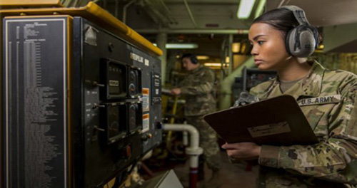 US Army Warrant Officer checking the gages in a US Army vessel.