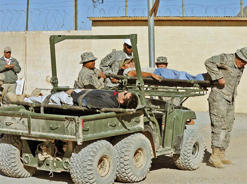 John Deere M-Gator being used as means to bring wounded back into a safe Area of Operations.