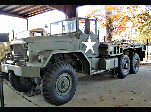 The side view of theM41 Truck 5 ton Cargo truck on exhibit at the TC Museum.