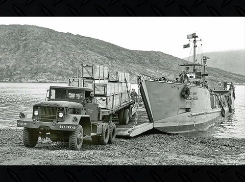 The M52A2 version of the tractor driving off a LCM.