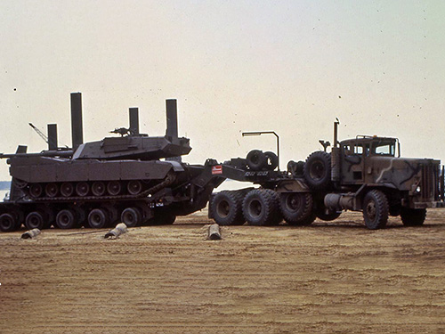 M911, Tractor pulling a tank.