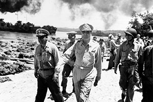 Gen. McArthur walking with his staff. Click on the audio file to hear the lecture by Chris Kolakowski.