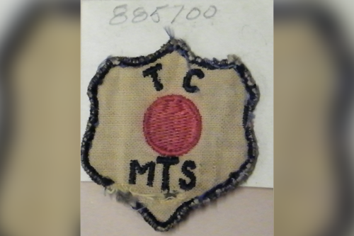 A Transportation Corps, Motor Transport Service insignia worn by members of the “Red Ball Express”.  This version, likely made in Europe was worn by MAJ Cornelius Rinker.  It was donated to the U.S. Army Transportation Museum collection by his family.
