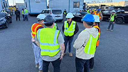 834th Transportation Brigade, holds a shift meeting as equipment and cargo is readied for rail movement from the Port of San Diego. 