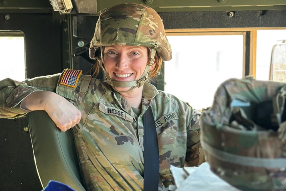 SPC Rochell Hesse, a Motor Transport Operator with 1041st Transportation Company, poses for a photo while waiting in a convoy. (Courtesy photo)