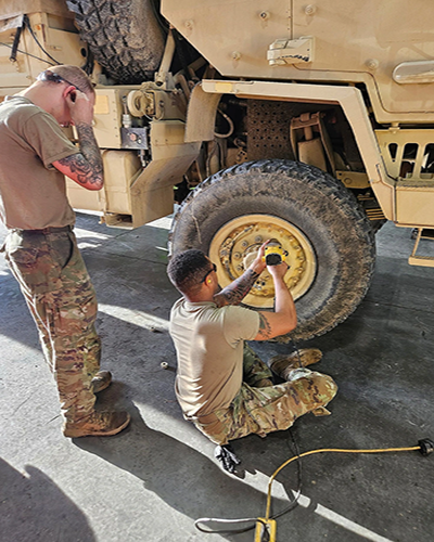 Photo By Willliam D. Ritter | Two Soldiers from the 1484th Transportation Company’s maintenance section finish changing a tire during the unit's two-week annual training at the Blue Grass Army Depot in Richmond, Ky. The eight Soldier section completed over 550 hours maintenance during the AT period and completed 14 work orders, three trailer services, and nine deadline repairs. Photo courtesy of 1484th Transportation Company, Ohio National Guard.