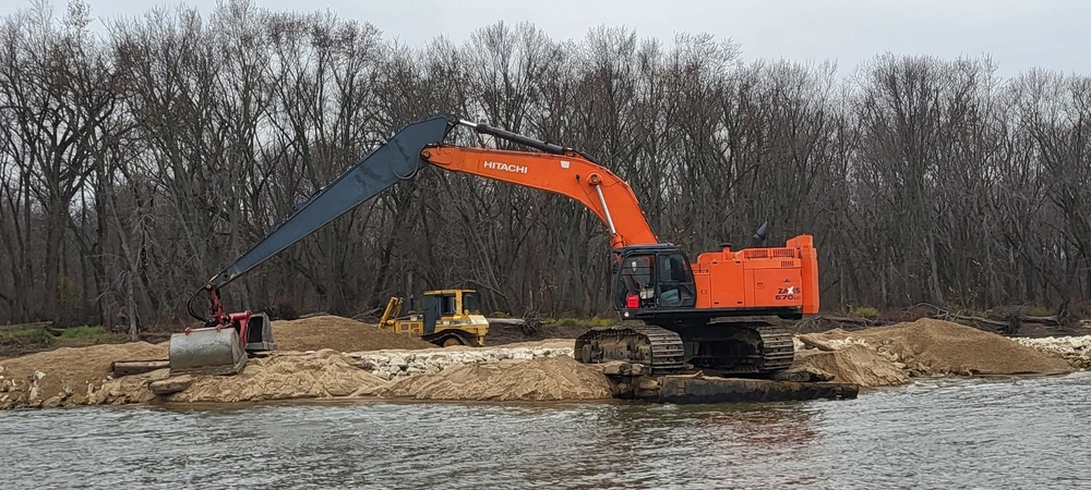 Photo By Samantha Heilig | A contractor uses dredged material from the Rock Island District’s Beneficial Use Program to build up the head of Steamboat Island for an Upper Mississippi River Restoration – Habitat Rehabilitation and Enhancement Project near LeClaire, Iowa.