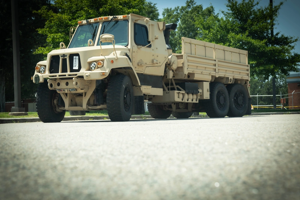 Photo By RYAN SHARP | A new Family of Medium Tactical Vehicle A2 parks in front of U.S. Army Combined Arms Support Command Headquarters May 20, 2025. U.S. Army Transportation School received two FMTVA2s for use in the Master Driving School to train the trainers.