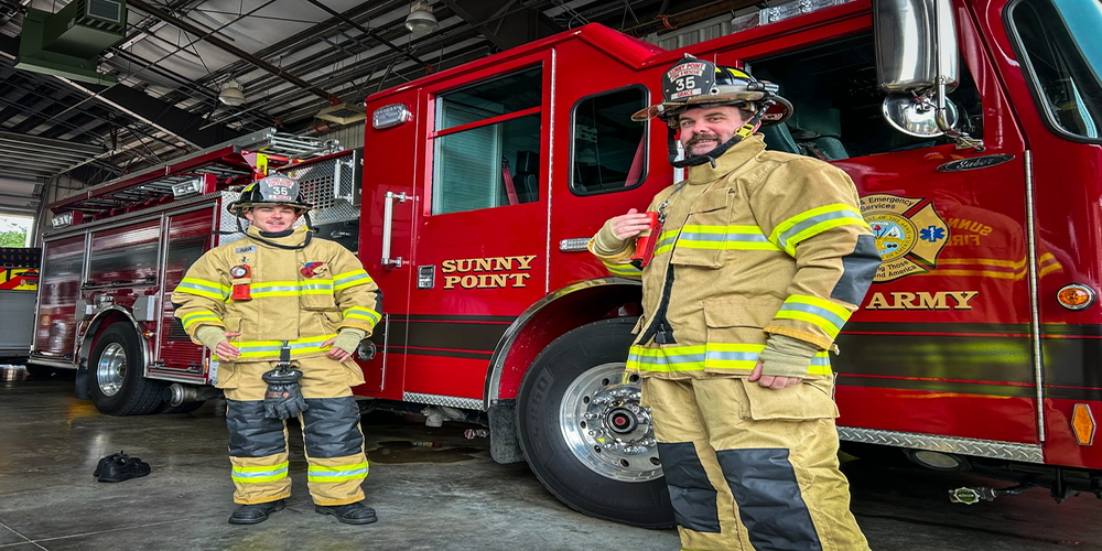 Photo By Christopher Parr | Jack Whalen, left, and Christopher Grace Jr., firefighters with the 596th Transportation Brigade, display their new PFAS-free bunker gear Aug. 12, 2025, at Military Ocean Terminal Sunny Point, N.C. (U.S. Army courtesy photo).