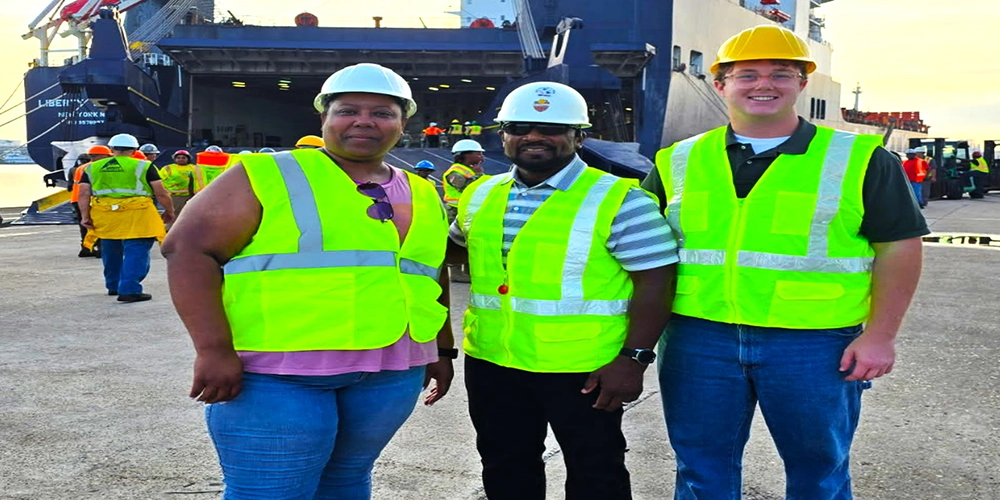 Photo By Staff Sgt. Elizabeth Bryson | (From left to right ) Sherita Bennett, Logistics Career Field Fellows Program, U.S. Army Civilian Career Management Activity (ACCMA), intern; Joe Hayslett, 597th Transportation Brigade, Surface Deployment and Distribution Command, operations (S3); and Matthew Hagenlocher, Logistics Career Field Fellows Program, ACCMA, intern; pose on a dock July 24, 2025, where they travelled to observe and document the load-out of equipment and supplies from the 4th Combat Aviation Brigade, 4th Infantry Division, onto a roll-on/roll-off container carrier at the Port of Beaumont, Texas. Both Fellows are shining examples of how Army Civilian careers open doors to worldwide impact, personal growth, fourth component partnerships and mission-critical service.