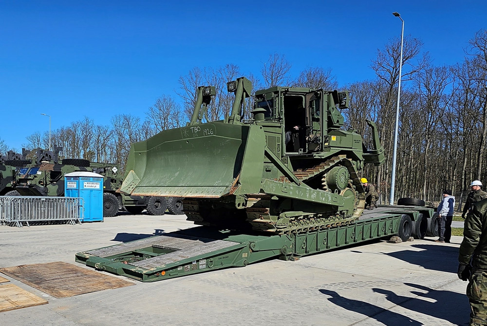 Courtesy Photo | A U.S. Army D7 medium track-type bulldozer from Army Prepositioned Stocks-2 is loaded onto an M870 semitrailer lowbed construction equipment transporter at the Powidz APS-2 worksite. Poland’s 33rd APS Support Battalion conducted training on the loading and transporting of a D7 bulldozer March 31 to April 4 at the site. (U.S. Army courtesy photo)