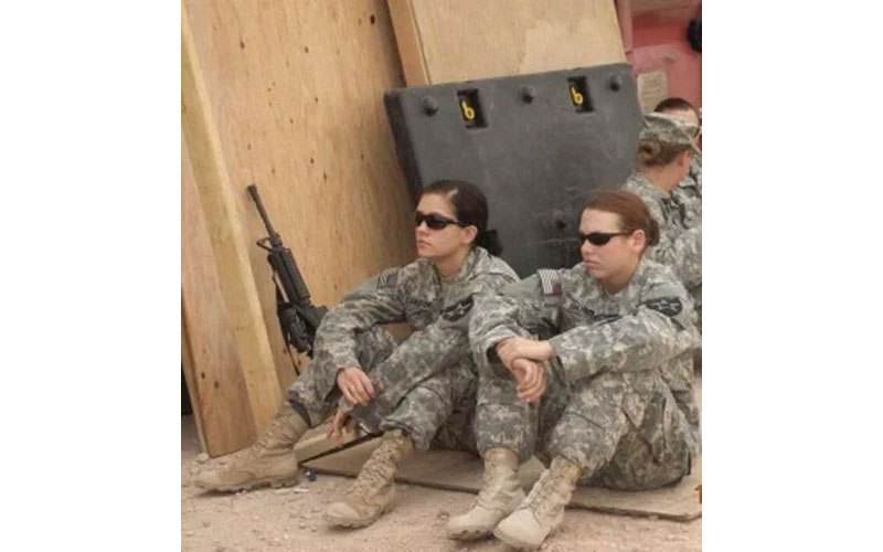 Angela Lunsford, left, and Monica Reyes take a break at forward operating base in Rustamiyah, Iraq. Courtesy photograph