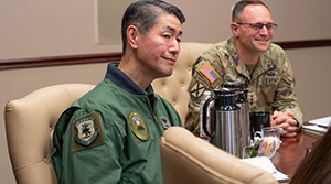Photo By Jessica Schaeffer | U.S. Army Lt. Gen. Jered Helwig, right, deputy commander of U.S. Transportation Command, and Japan Air Self-Defense Force Lt. Gen. Chuji Ando, commander of Air Support Command, receive a briefing at Scott Air Force Base, Illinois, Dec. 17, 2025. Ando visited the command to discuss shared global mobility goals.