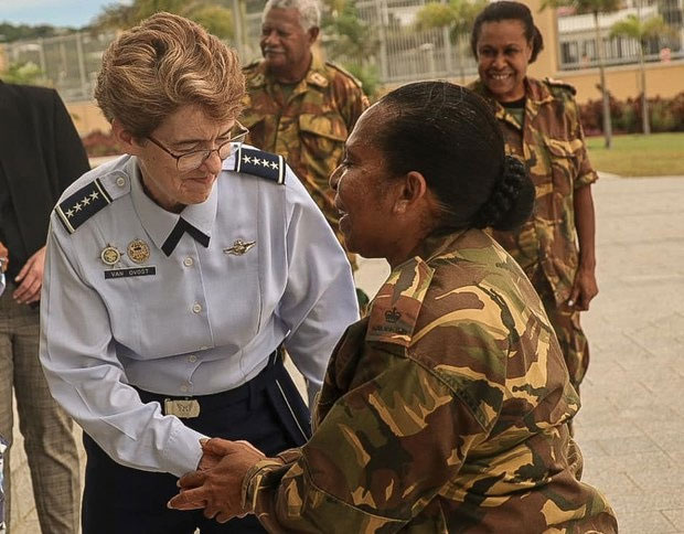 In this photo published by the U.S. embassy in Port Moresby, Commander of the U.S. Transportation Command, Gen. Jacqueline Van Ovost, greets a member of Papua New Guinea’s Defense Force in Port Moresby during a December 2023 visit to the Pacific island country.