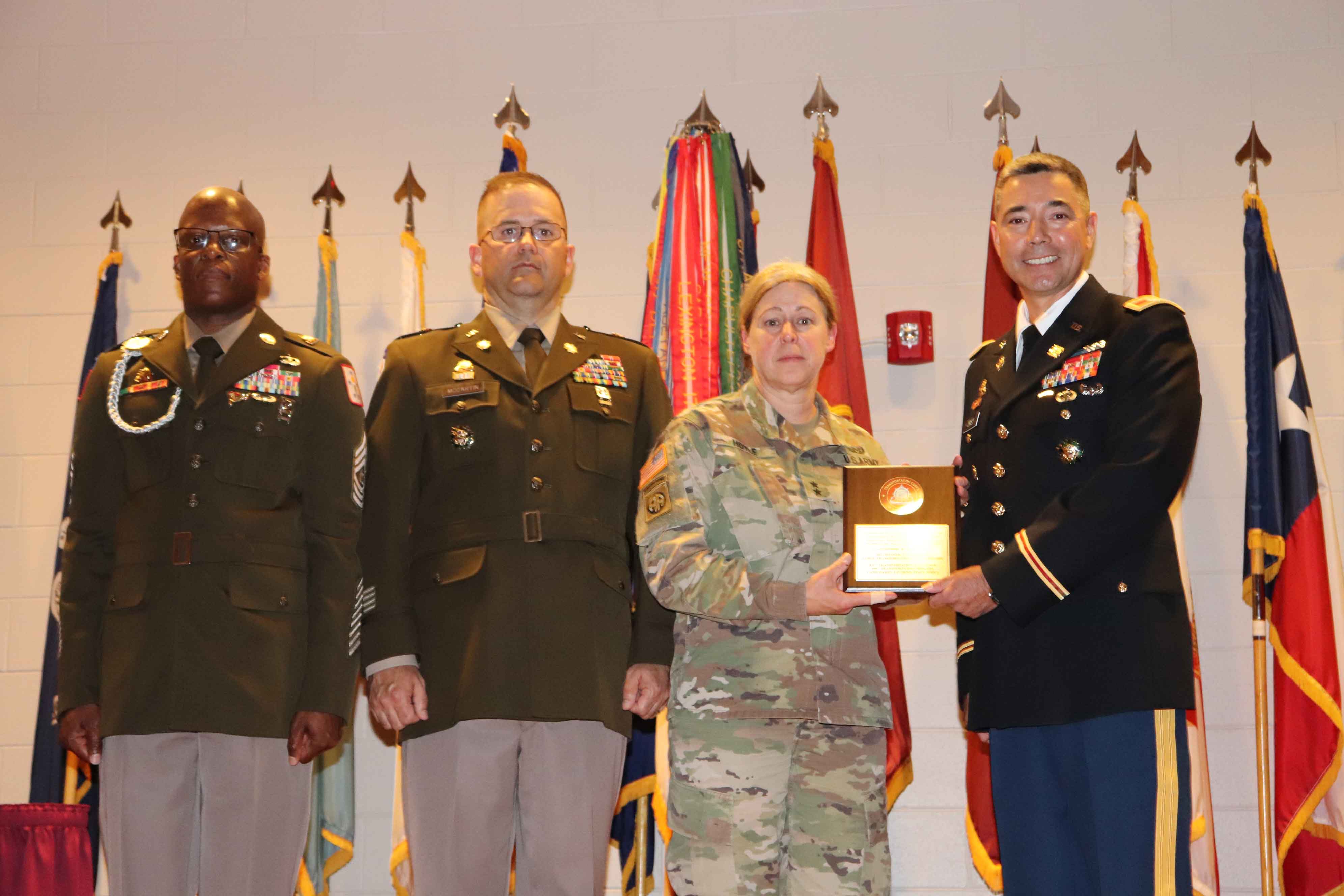 MG Heidi Hoyle, Commanding General of the Surface Deployment Distribution Command (SDDC) accepts the award on behalf of the 839th Transportation Battalion.