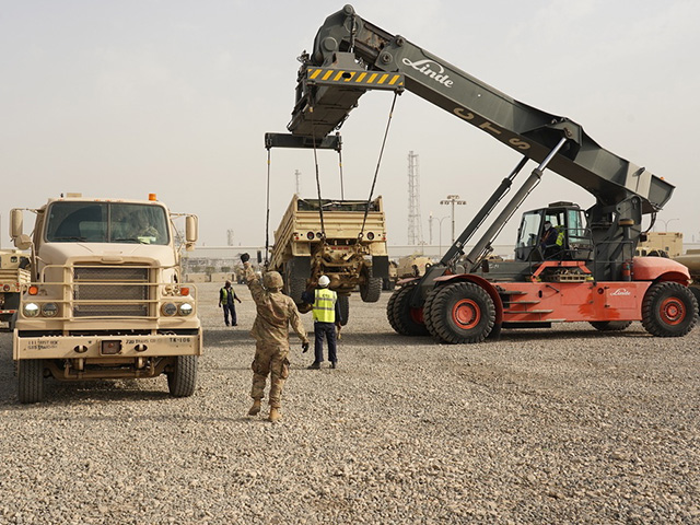 Deployed Soldiers loading a trailer using a RTCH