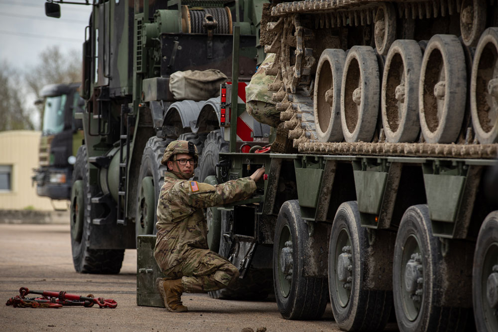 U.S. Army Spc. Refugio Chavez, a motor transport operator assigned to the 51st Composite Truck Company, 18th Combat Sustainment Support Battalion, 16th Sustainment Brigade verifies rigs for heavy equipment transportation during Orion 23, April 23, 2023. ORION 23 is a French-led interoperability exercise that is designed to develop partnerships with allies and asses the ability to operate within a coalition. (U.S. Army photo by Pfc Alejandro Carrasquel)