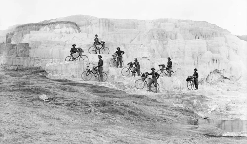 Members of the 25th Infantry Bicycle Corps pose on Minerva Terrace at Mammoth Hot Springs in Yellowstone National Park in 1896. Montana Historical Society