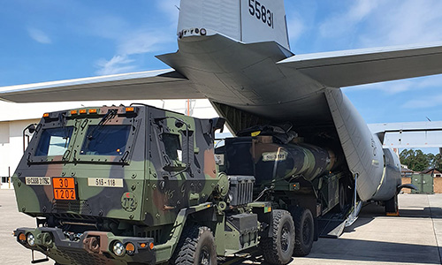 Transportation Corps loads a cargo plane for airlift strategic deployment mission.