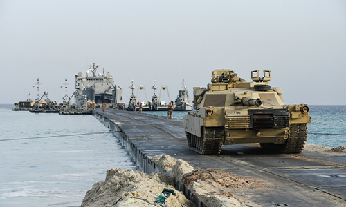 M60 Abrams Tank disembarking from a watercraft during watercraft transport operations.